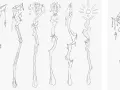Divers croquis de bâtons magiques, certains ornés de crânes et de pendentifs, d'autres avec des formes organiques ou solaires. L'artiste explore différentes idées pour faire des croquis.
