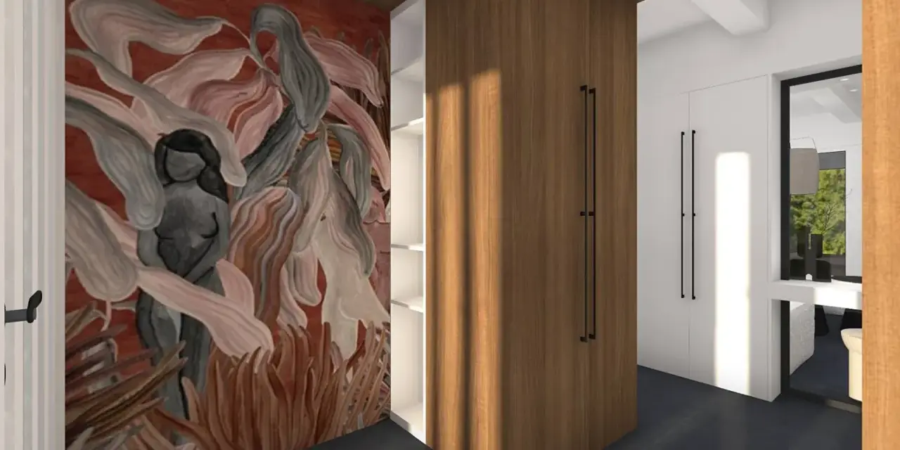 Une oeuvre connue ornée d'une silhouette féminine se détache sur un mur rouge, dans un espace moderne avec des placards en bois.