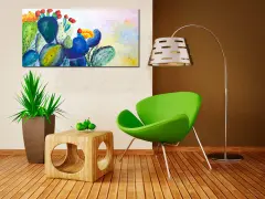 Un tableau cactus moderne aux couleurs vives, avec des touches de bleu, vert et jaune, illumine un salon contemporain.