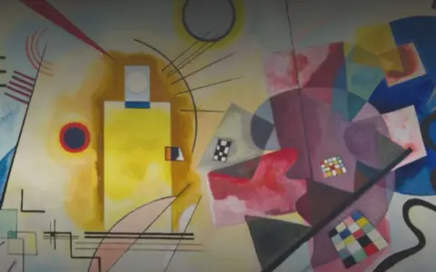 Un tableau carré rouge, jaune, bleu, avec des formes abstraites et des lignes noires.