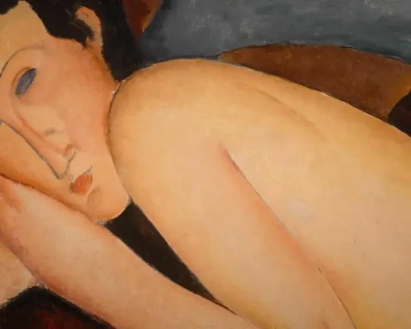 Modigliani peinture : un portrait de femme aux traits allongés, la tête appuyée sur son bras, dans une pose languide.