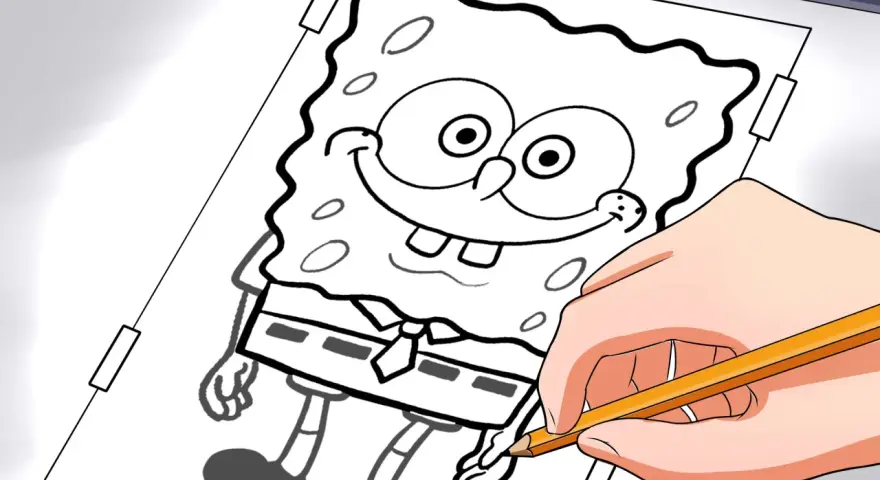 Une main tient un crayon pour apprendre comment décalquer avec du papier calque, traçant un dessin de Bob l'éponge.