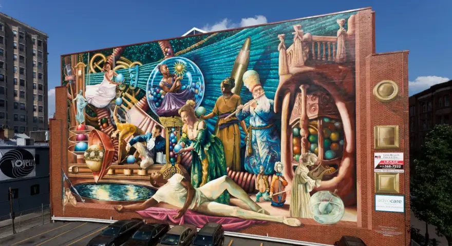 Fresque colorée représentant des personnages historiques et mythologiques, un artiste engagé qui dépeint la richesse culturelle.