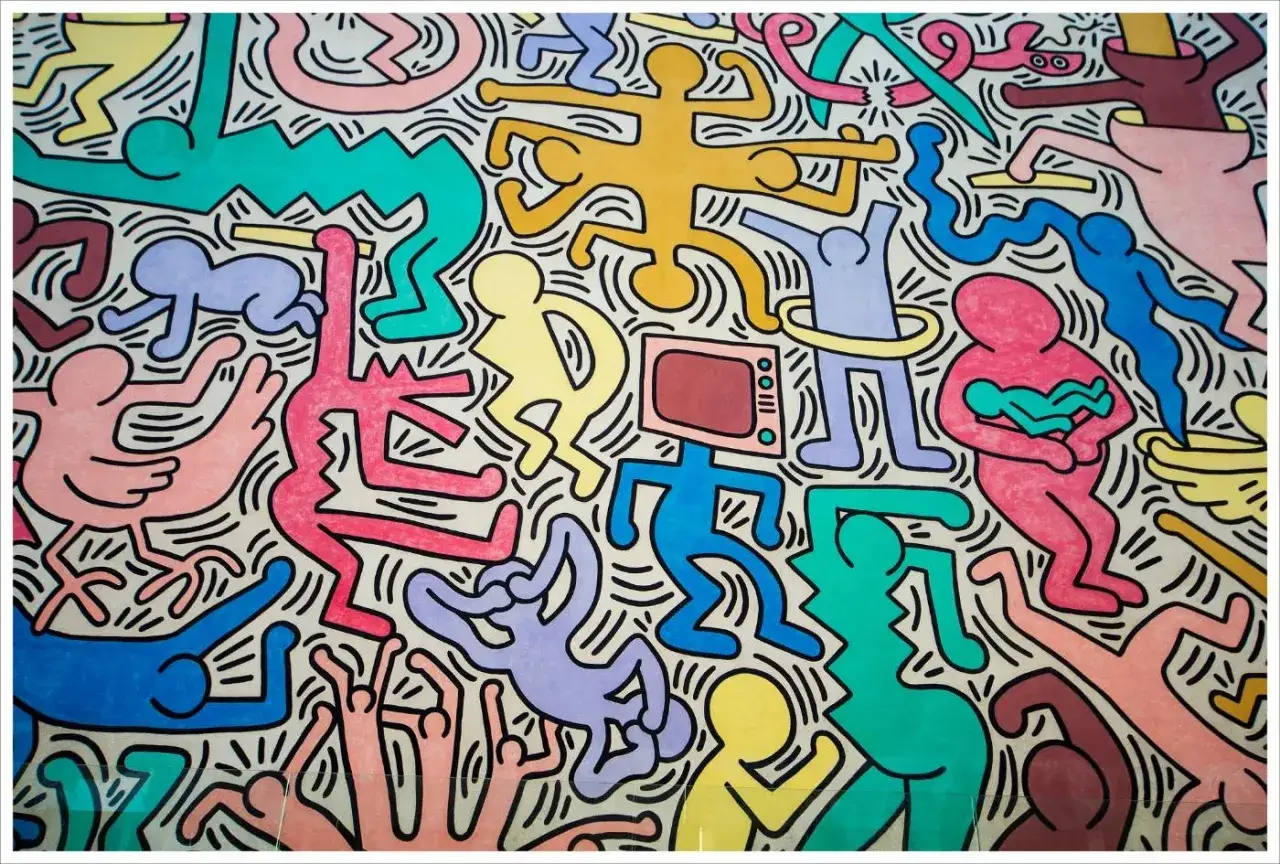 Une foule de bonhommes color&eacute;s de Keith Haring dansent et s'entrem&ecirc;lent, cr&eacute;ant une sc&egrave;ne vibrante et joyeuse.
