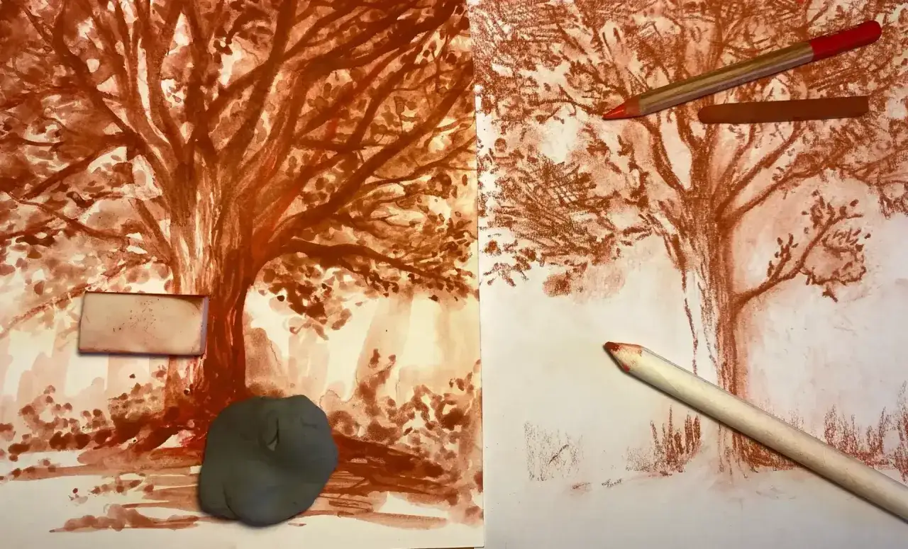 Deux feuilles montrent un arbre en cours de dessin &agrave; la sanguine. Un crayon et une gomme sont pos&eacute;s sur le papier, sugg&eacute;rant un dessin sanguine facile.
